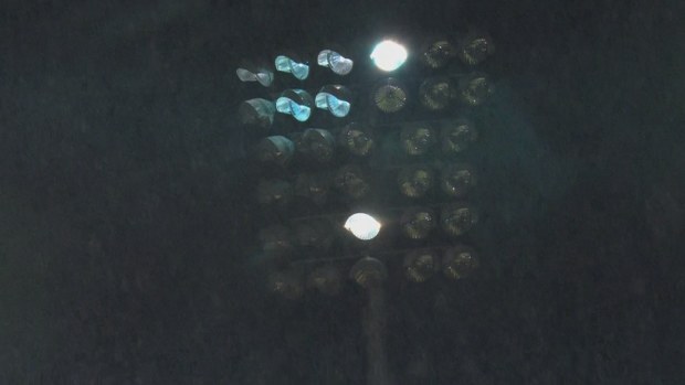 A light tower at BlueBet Stadium fell to darkness as players ran onto the field for the second half.