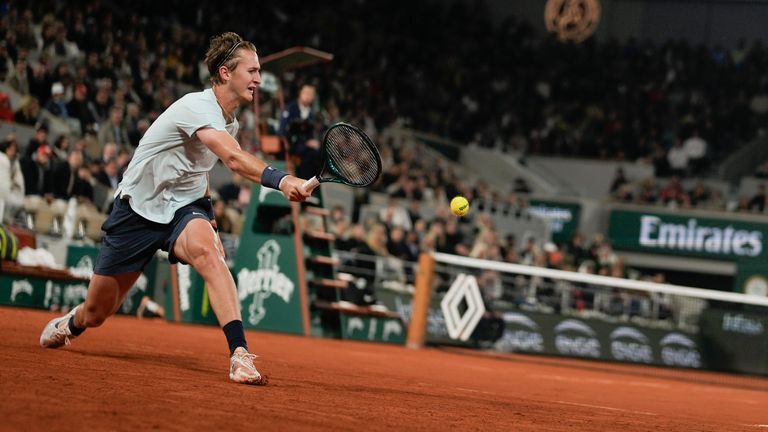 Sebastian Korda of the U.S. plays a shot against Spain's Carlos Alcaraz during their third round match of the French Open tennis tournament at the Roland Garros stadium in Paris, Friday, May 31, 2024. (AP Photo/Thibault Camus)