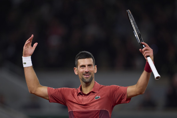 Novak Djokovic of Serbia celebrates a point against Lorenzo Musetti of Italy.