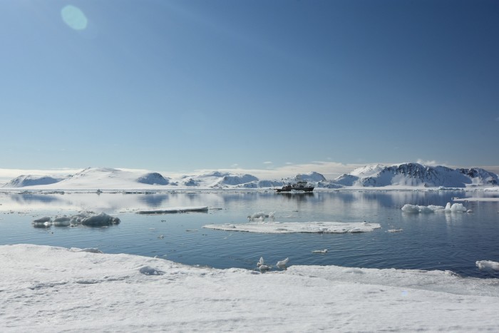 The NWS yacht RV Kinfish sails among icebergs in Svalbard