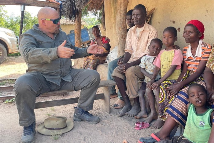 Mike Labuschagne talks to villagers