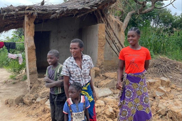 Villagers living near Zambia’s border with Malawi outside a building damaged by elephants