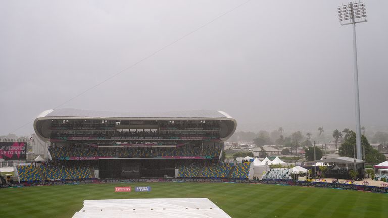 Rain interrupts an ICC Men's T20 World Cup cricket match between Scotland and England at Kensington Oval in Bridgetown, Barbados, Tuesday, June 4, 2024. (AP Photo/Ricardo Mazalan)