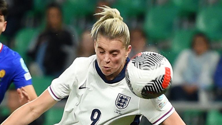 Alessia Russo heads in England's second against France. 