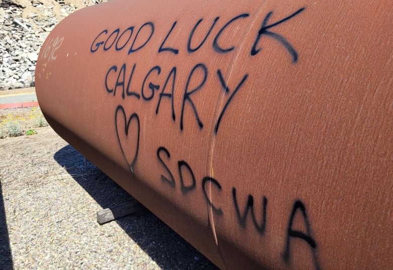 a large pipe that reads "good luck calgary"