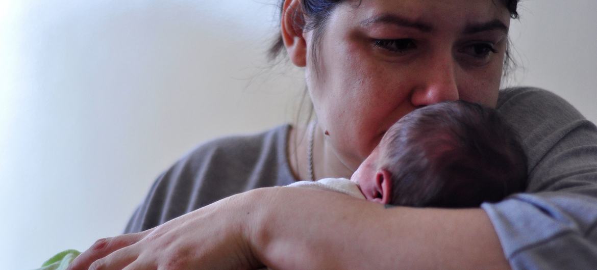 A mother holds her newborn baby at a hospital in Kyiv, Ukraine. (file)