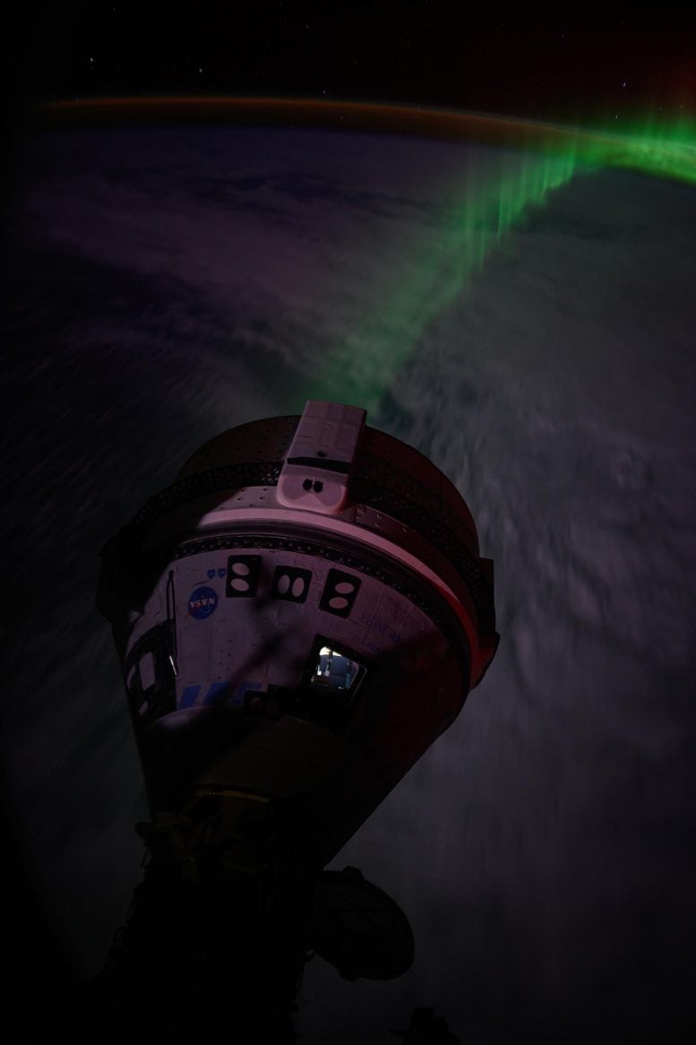 Aurora Streams Below Boeing’s Starliner Spacecraft