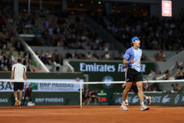 Alex De Minaur celebrates a point against Alexander Zverev during the Men's Singles Quarter Final at Roland Garros.