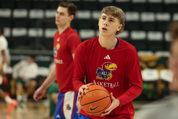 Kansas Jayhawks guard Johnny Furphy warms up.