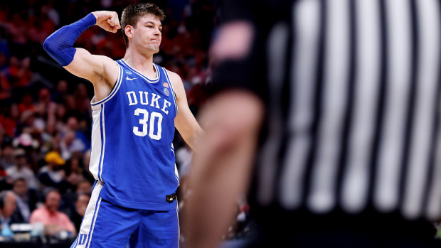 Kyle Filipowski of the Duke Blue Devils reacts following a basket and drawing foul.