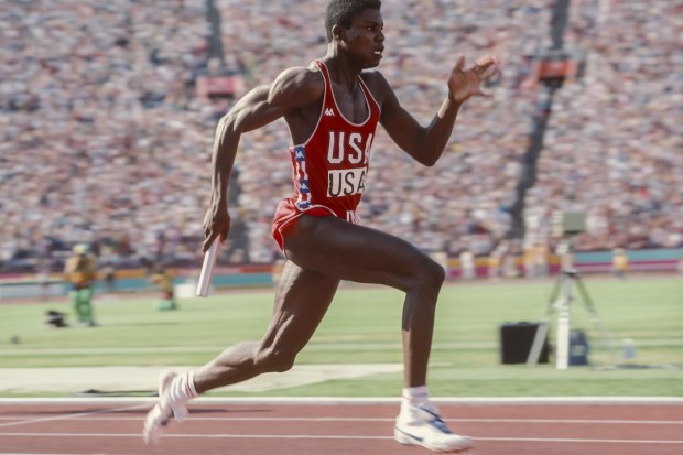 Carl Lewis anchoring the USA's men's 4x100m relay team to gold in world record time in Los Angeles.