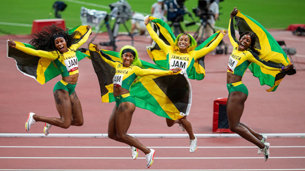 Jamaica's 4x100m women's relay team celebrates winning gold at Tokyo 2020.