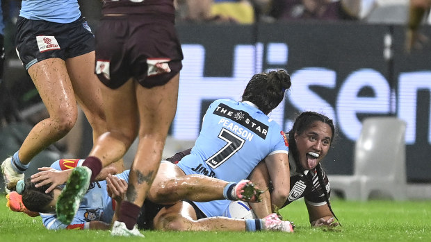 Tazmin Rapana of the Maroons celebrates with teammates after scoring a the match-winning try.