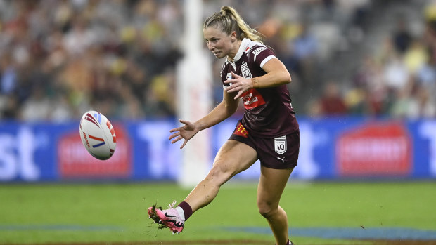 Tarryn Aiken of the Maroons kicks the ball.