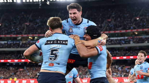 Mitchell Moses celebrates with Zac Lomax and Stephen Crichton after the NSW halfback out up a perfect kick for Lomax to score.