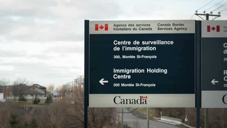 A sign to an 'immigration holding centre.'