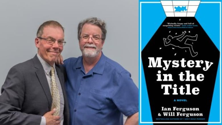 Two men with short grey hair and glasses, one in a grey suit and the other in a blue collared shirt, smile with their arms around each other next to a blue and black book cover.