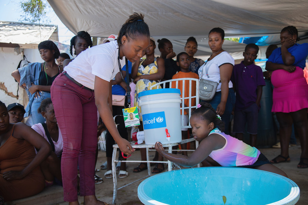 A child in Port-au-Prince, Haiti, learns about the importance to her health of washing hands.
