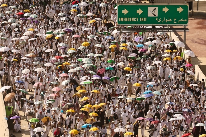 Muslim pilgrim arrive to perform the symbolic 'stoning of the devil' ritual during the annual hajj pilgrimage in Mina on June 16, 2024. Friends and family searched for missing hajj pilgrims on June 19 as the death toll at the annual rituals, which were carried out in scorching heat, surged beyond 1,000.