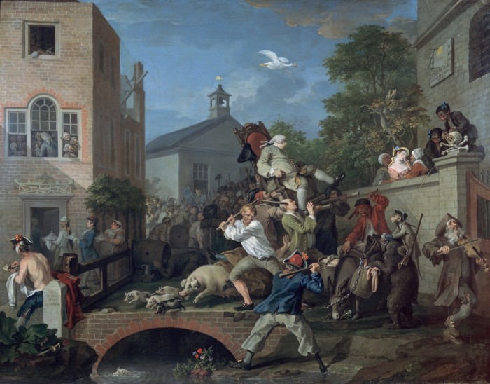A busy street scene in which a man in a wig is carried aloft in a chair that seems about to topple as one of the men carrying it is struck as two other men fight with sticks. Pigs scuttle by and look set to fall into the stream