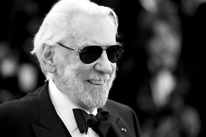 Actor Donald Sutherland is shown in a black and white photo from 2016.