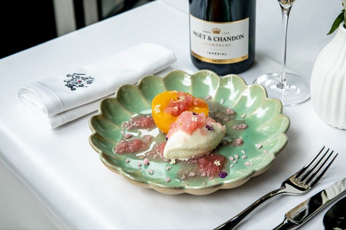 Peaches and ice-cream drizzled with Moët Impérial at the pop-up restaurant  