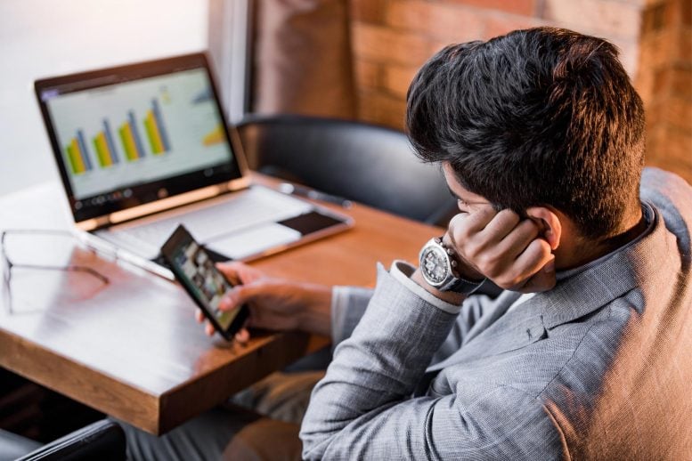 Man Procrastinating in Office