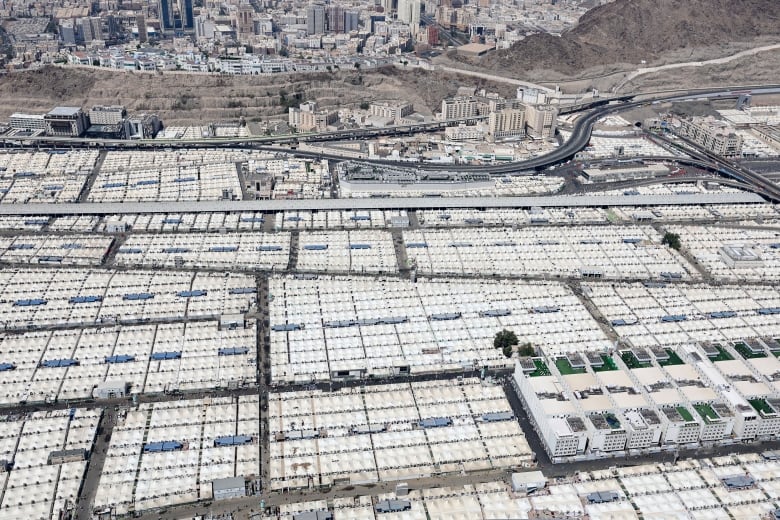 An aerial view shows the hajj pilgrims' camp in Mina near Saudi Arabia's holy city of Mecca on June 17, 2024. Saudi Arabia on June 17 warned of a temperature spike in Mecca as Muslim pilgrims wrapped up the hajj in searing conditions, with more than a dozen heat-related deaths confirmed. 