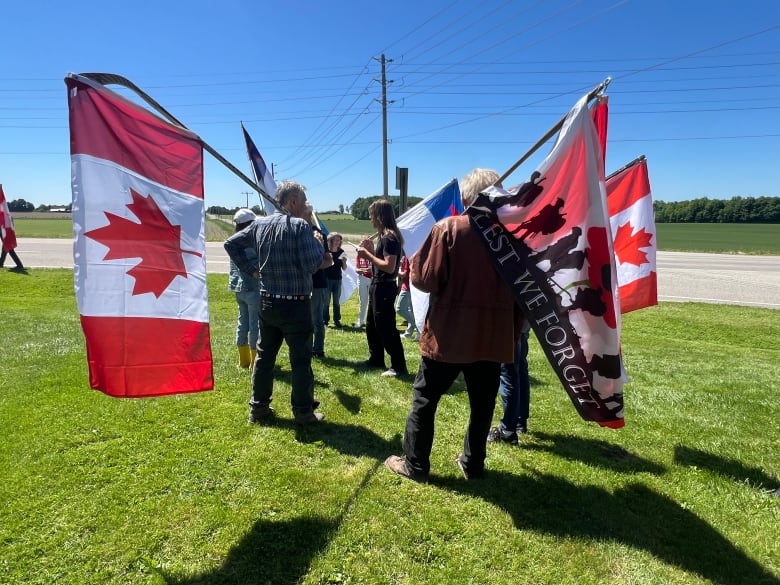 Many of those opposed to the raising of the Pride flag came carrying Canada flags.