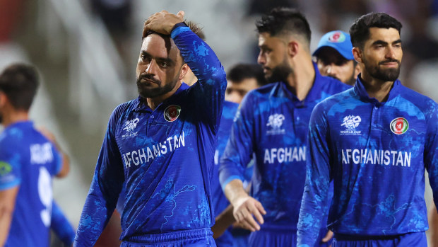 Rashid Khan of Afghanistan looks dejected while leaving the field after the team's defeat in the ICC Men's T20 Cricket World Cup West Indies & USA 2024 Semi-Final match between South Africa and Afghanistan at Brian Lara Cricket Academy on June 26, 2024 in Tarouba, Trinidad And Tobago. (Photo by Robert Cianflone/Getty Images)