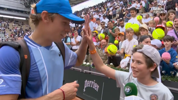 Alex de Minaur and super fan 'Paul.'