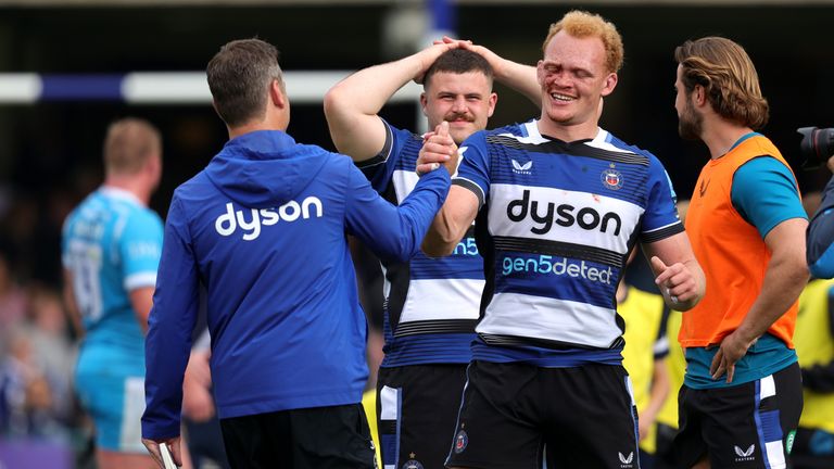 Bath head coach Johann van Graan celebrates with Miles Reid after the win over Sale