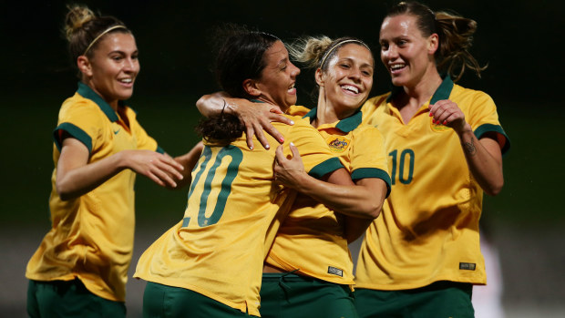 Sam Kerr of the Matildas celebrates with team mates after scoring a goal during the international women's friendly match between the Australian Matildas and Vietnam in 2015.