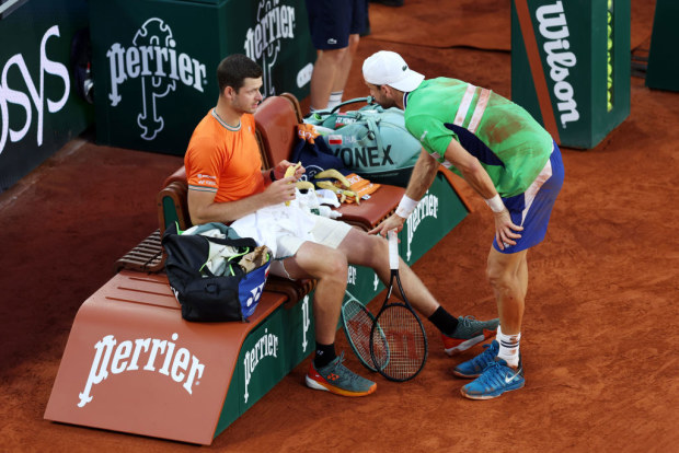 French Open 2024: Grigor Dimitrov speaks to Hubert Hurkacz during change over; Hubert Hurkacz V Grigor Dimitrov.