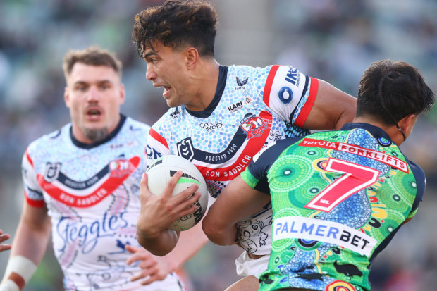 Joseph-Aukuso Su'ali'i is tackled by  Raiders' halfback Kaeo Weekes.