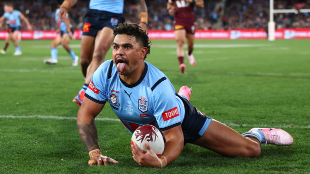 Latrell Mitchell of the Blues celebrates scoring a try.