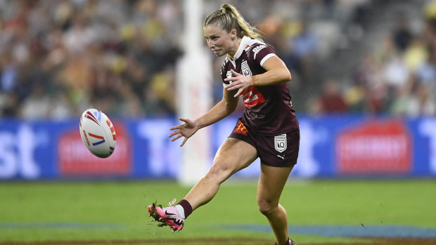 Tarryn Aiken of the Maroons kicks the ball.