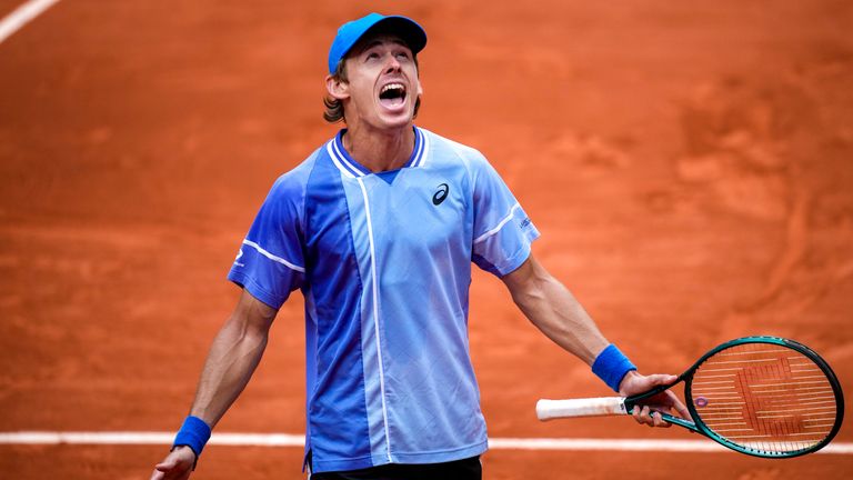 Australia's Alex De Minaur celebrates winning his fourth round match of the French Open tennis tournament against Russia's Daniil Medvedev at the Roland Garros stadium in Paris, Monday, June 3, 2024. (AP Photo/Christophe Ena)