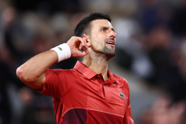 Novak Djokovic of Serbia celebrates a point against Lorenzo Musetti of Italy.