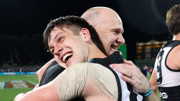 Ken Hinkley, Senior Coach of the Power and Zak Butters celebrate during the 2020 finals series.