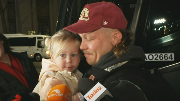 Reuben Cotter and his two-year-old daughter Sunny spoke to media before getting on the Maroons bus the morning after Origin II.