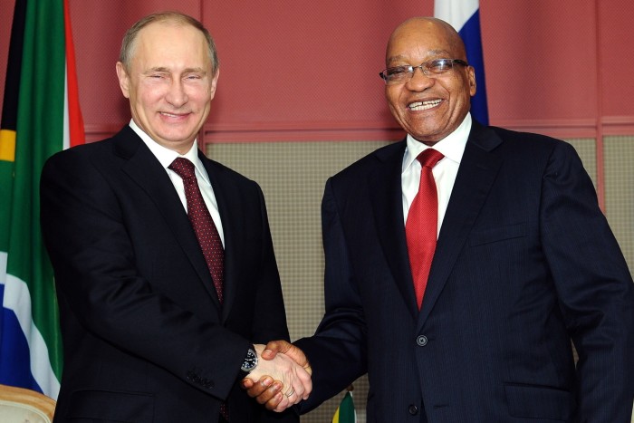 Russian President Vladimir Putin shakes hands with Jacob Zuma