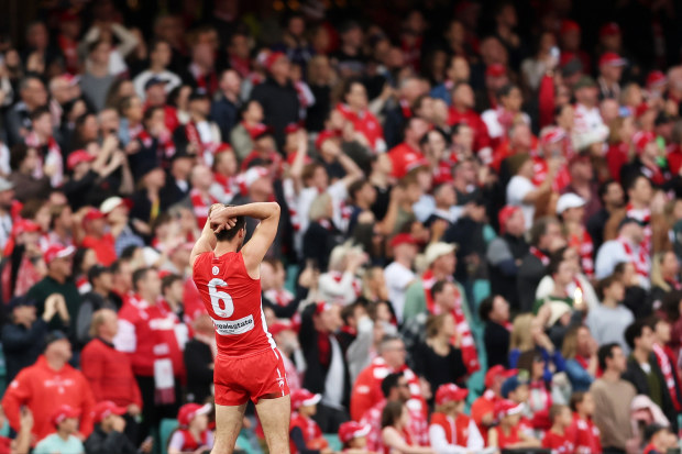 Logan McDonald of the Swans reacts after his final kick of the game misses completely.