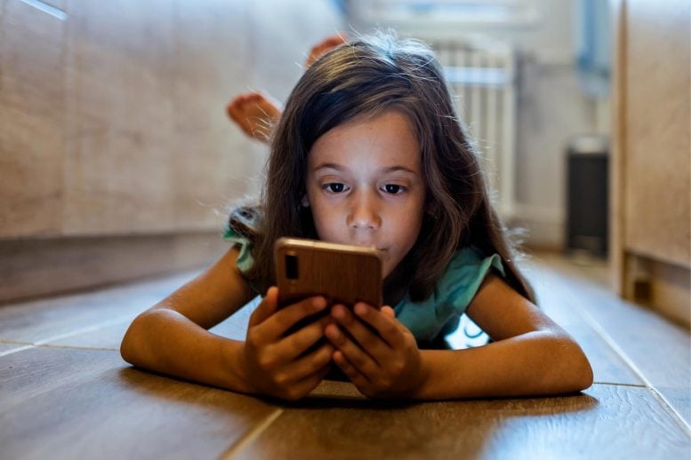 Child Watching Phone Screen