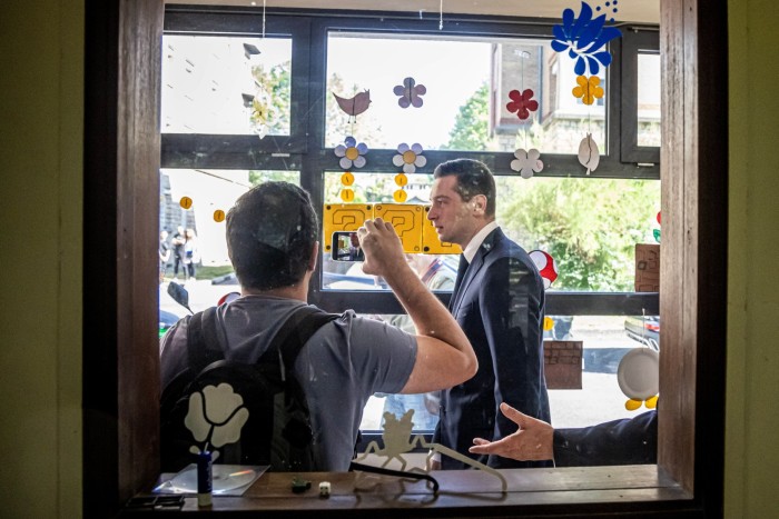 RN president Jordan Bardella arrives at an electronic polling station in Garches, near Paris, on Sunday