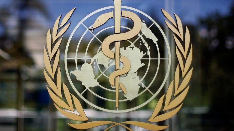 The logo of the World Health Organization is seen at the WHO headquarters in Geneva, Switzerland.