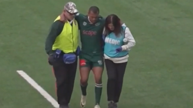 Kurtley Beale is helped off the field.