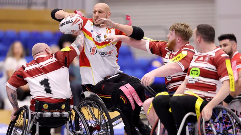 Picture by John Clifton/SWpix.com - 01/06/2024 - Rugby League - Betfred Wheelchair Challenge Cup Final - Catalans Dragons Wheelchair v Wigan Warriors Wheelchair - EIS Sheffield, Sheffield, England -
Catalans Dragons' Jeremy Bourson in action with Wigan Warriors' Chris Greenhalgh