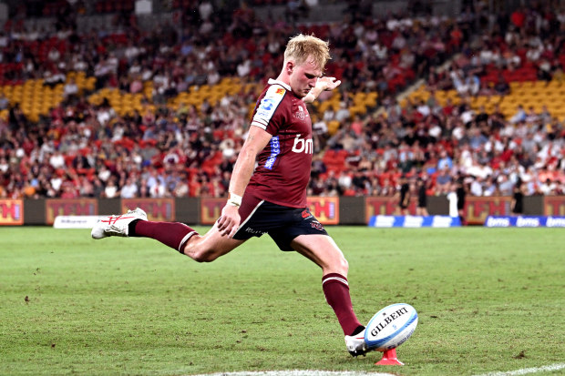Tom Lynagh of the Reds kicks a conversion at Suncorp Stadium.