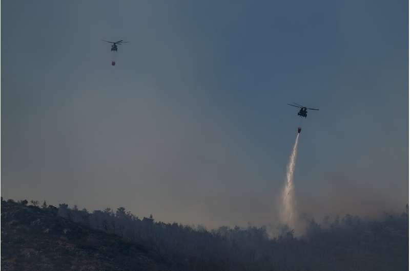 Greece is battling dozens of wildfires  -- one at Mount Parnitha, known as  &quot;the lungs of Athens&quot; was brought under control late Saturday  